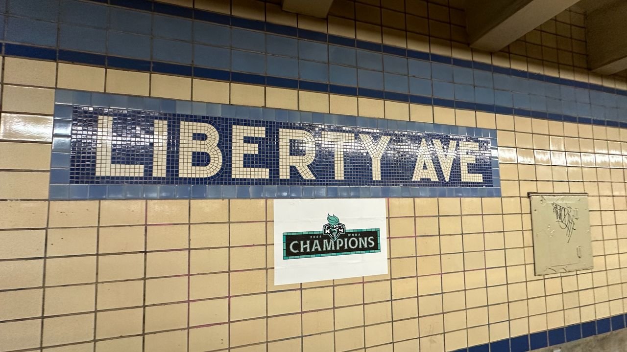 Decals honoring the team’s victory will be displayed at subway stations, including Liberty Avenue. (Spectrum News NY1/Noorulain Khawaja)